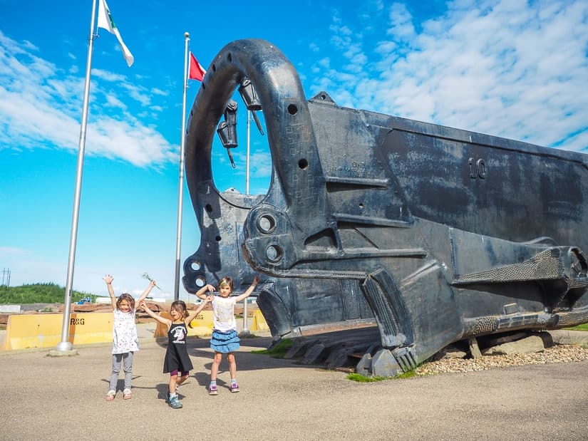 Children and dragline bucket at the Fort McMurray Giants of Mining