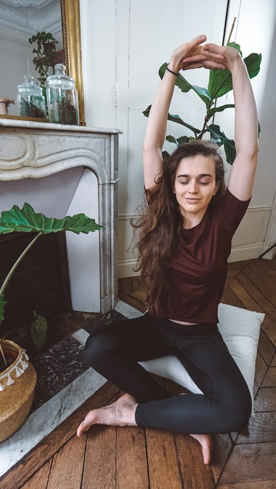 The author doing yoga while traveling