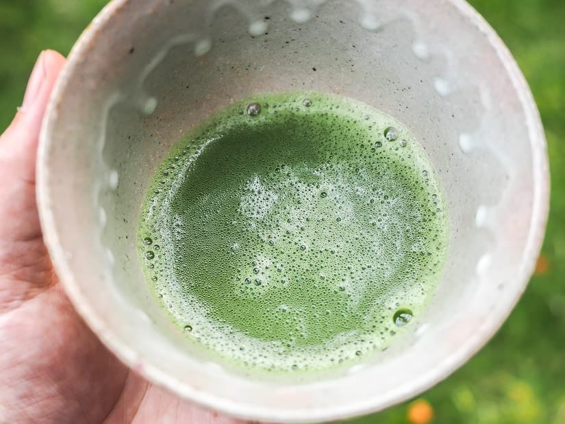 Close up of bowl of matcha green tea from the Japanese tea ceremony at Nikka Yuko