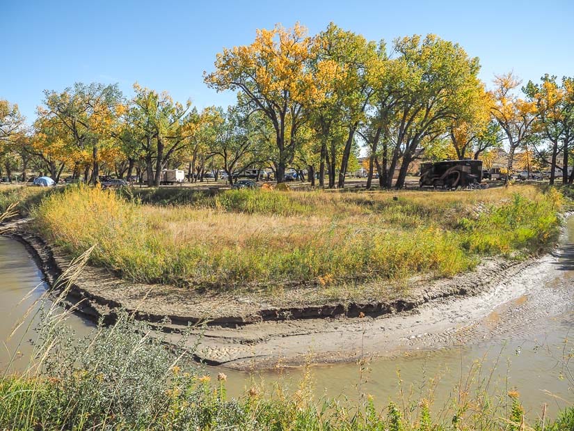 View across a creek to a section of the campground at Dinosaur Provincial Park