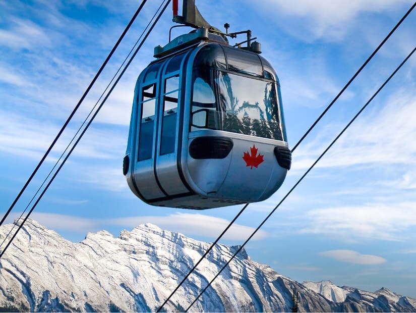 Riding the Banff gondola in winter, with mountains in the background