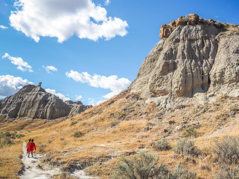 Two kids hiking from Dinosaur Provincial Park campground to Coulee Viewpoint Trail