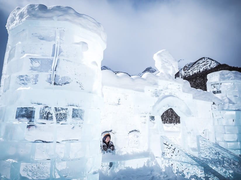 Child inside an ice castle at Lake Loiuse