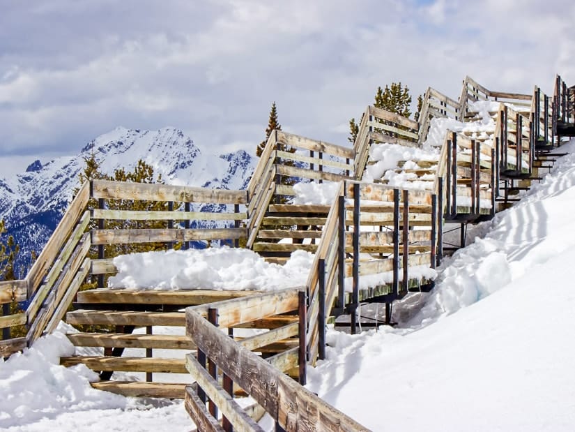 Boardwalk covered in snow on top of Sulfur Mountain in Banff