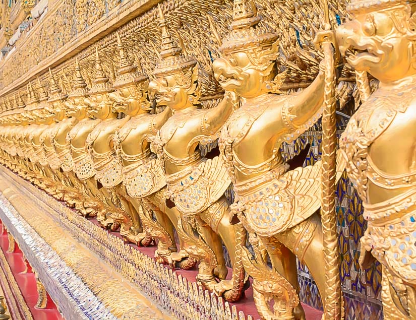 Golden statues on the exterior of Wat Phra Kaew, the most important temple in Thailand