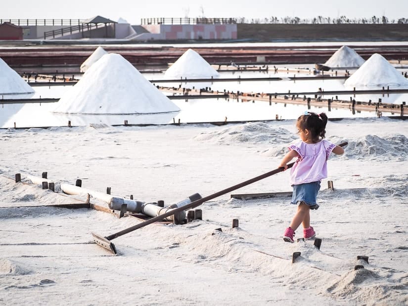 A young girl playing in the salt field in Tainan Taiwan