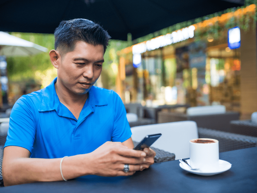 A Thai man using his cell phone 