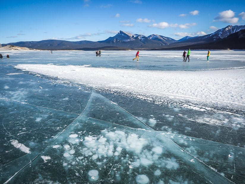 People ice skating at Abraham Lake in Winter