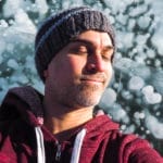 Me lying on some ice bubbles at Abraham Lake, Alberta, Canada