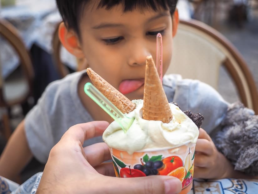 A kid eating gelato in Italy