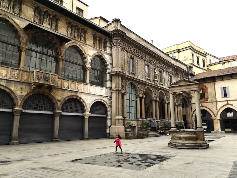 A child playing in a square in Milan