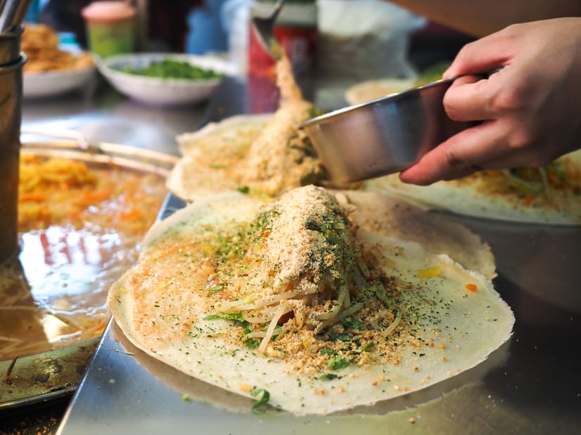 Close up of a few Taiwanese burritos being made on a metal counter