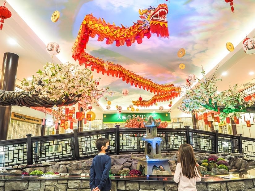 Our kids looking at a dragon in Chinatown in West Edmonton Mall