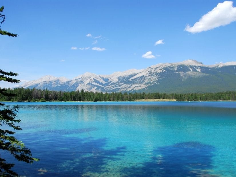 Super blue water of Annette lake, one of the most popular lakes in Jasper