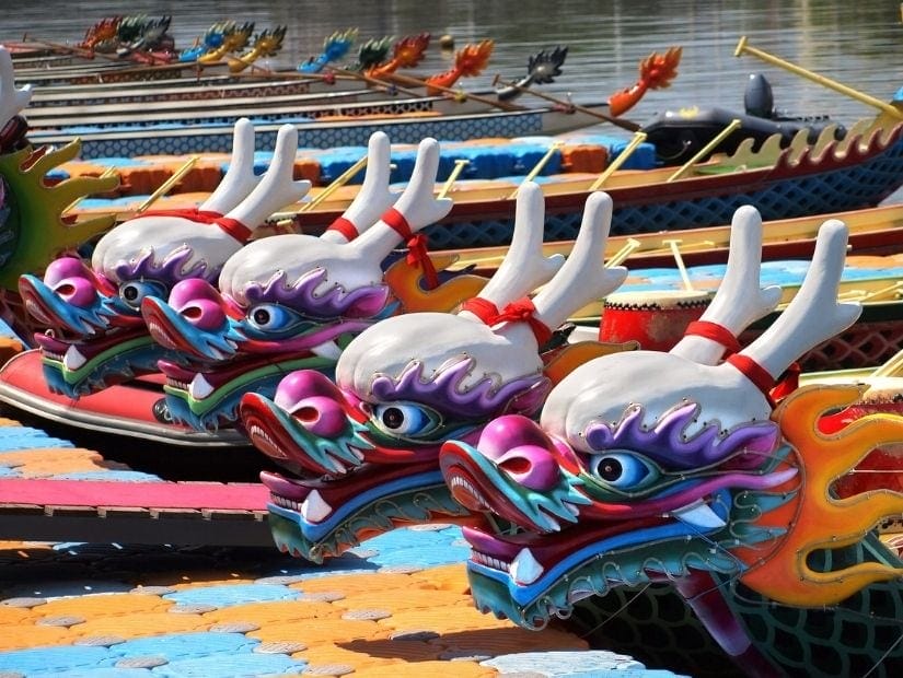 Dragon boats lined up in a river for the dragon boat festival in Taiwan