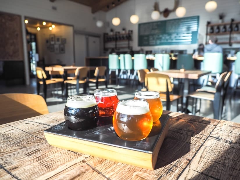 Beers on a table at Folding Mountain Brewery, Hinton