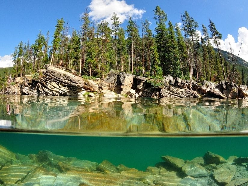 Cliffs beside Horseshoe Lake, one of the best lakes for cliff diving and swimming in Jasper