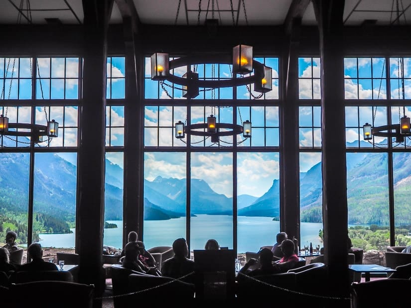 Seating area inside Prince of Wales Hotel Waterton with Waterton lakes view in background