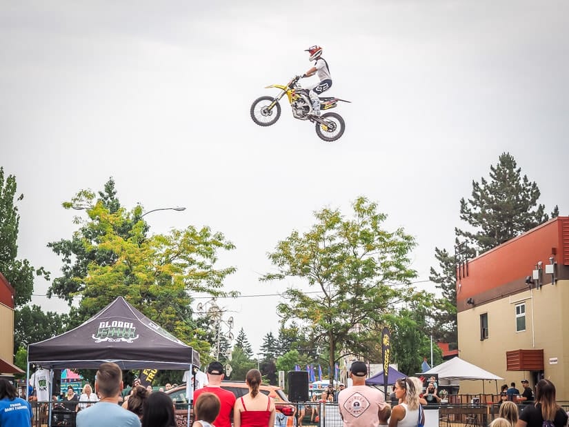 Motorcycle flying through the air above a crowd of people at the Abbotsford Agrifair