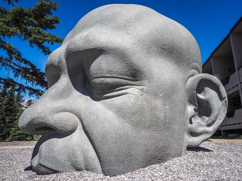 Close-up of Big Head sculture in downtown Canmore