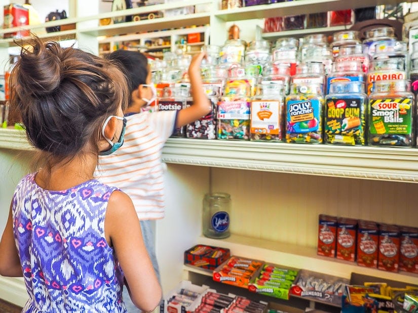 Kids looking at candy in Clayburn Village Candy Store