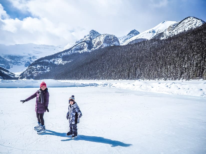 A mother and child ice skating on Lake Louise
