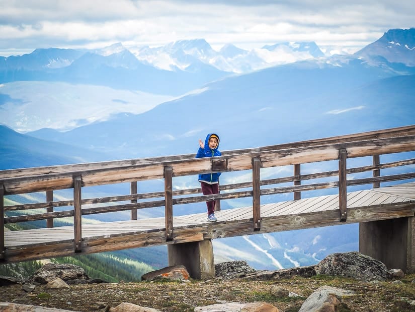 A kid standing on the boardwalk outside Jasper Sky Tram Upper Station