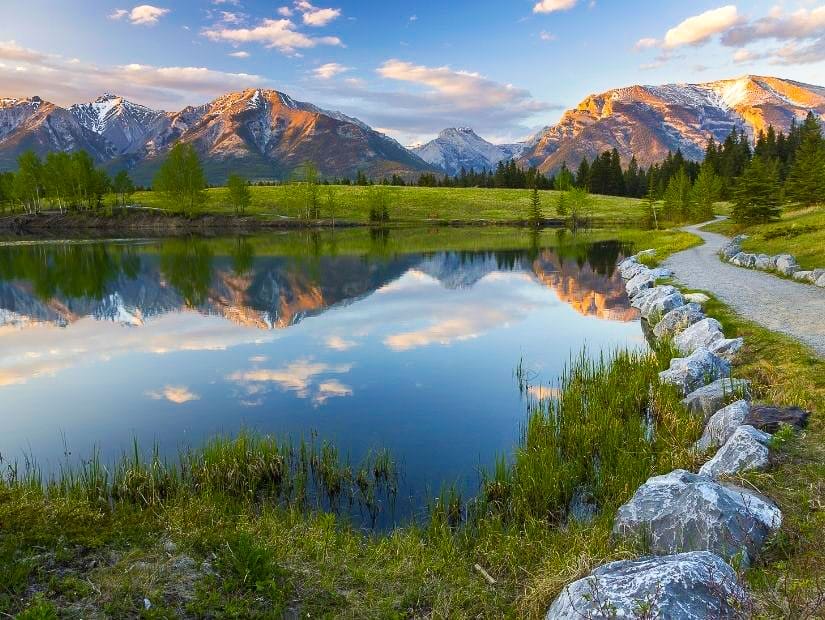 A walking trail beside Quarry Lake, one of the best places to swim in Canmore