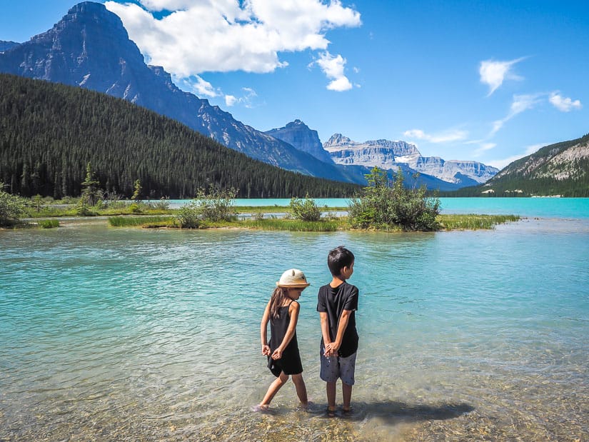 Two kids standing in Waterfowl Lakes, Banff