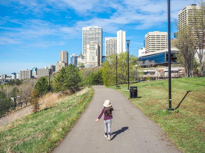 A young kid walking down a trail in the Edmonton River Valley