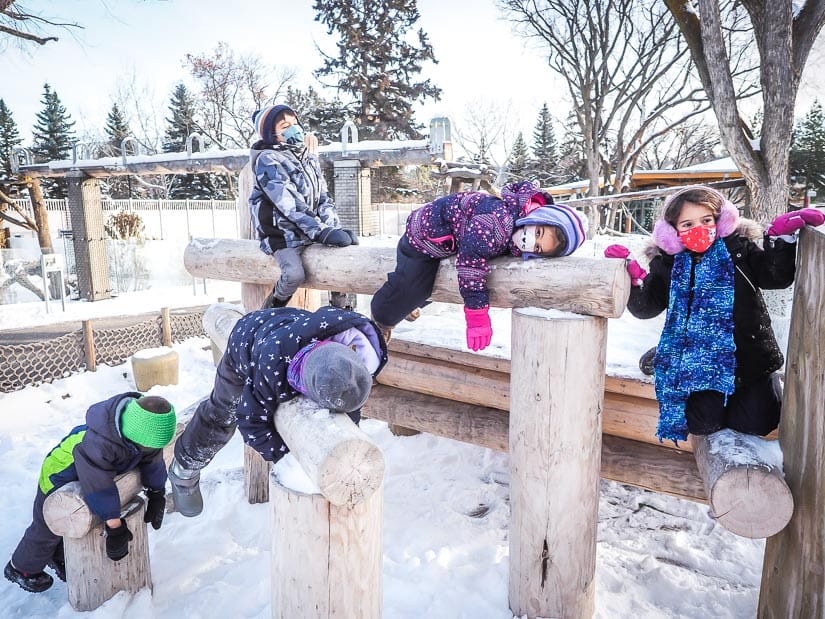 Five kids playing in a playground at Edmonton Valley Zoo
