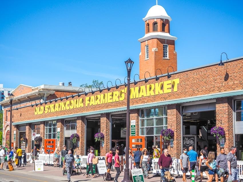 Front of Old Strathcona Farmers Market with many shoppers in front