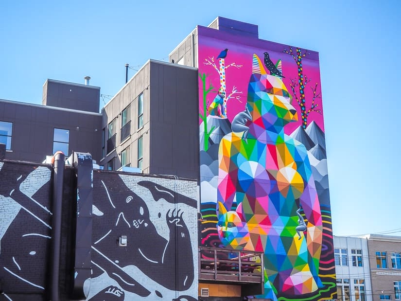 A painted mural in Old Strathcona by Okuda San Miguel on the back of Crawford Block