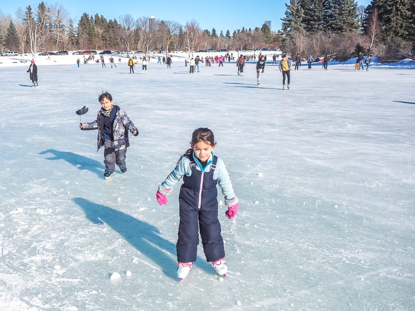 Two kids ice skating at Hawrelak Park