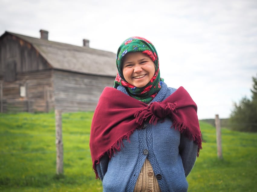 Interpreter standing in a field at Ukrainian Village