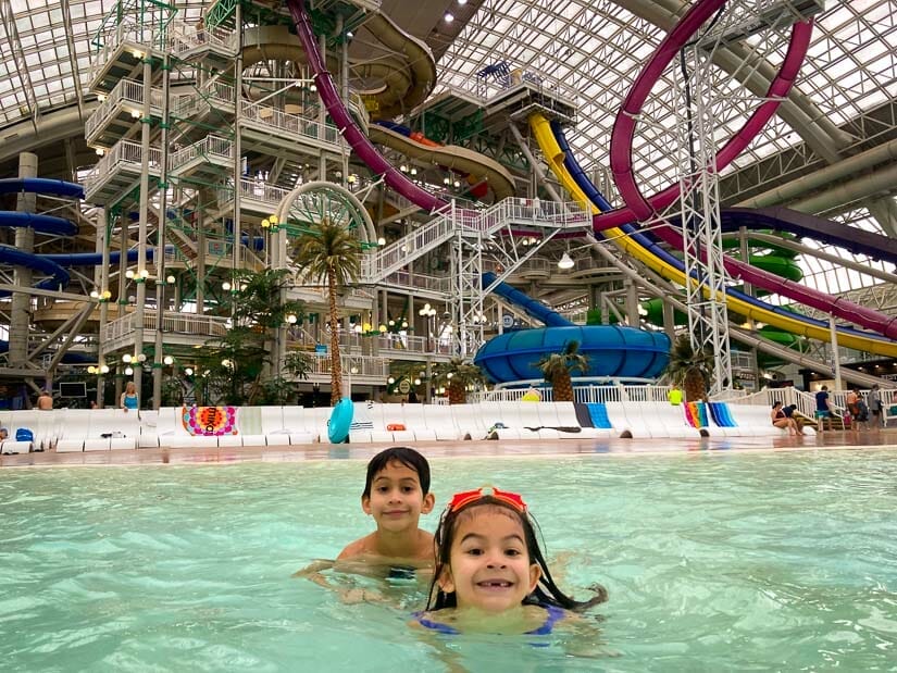 Two young kids playing in the wave pool at West Edmonton Mall World Waterpark