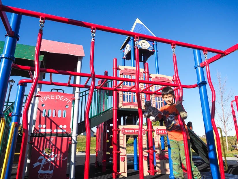 A kid playing in Eaux Claires Playground