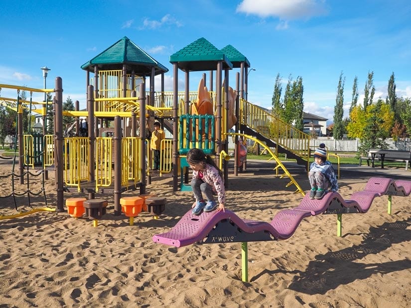 Two kids playing in Hudson Playground, Edmonton