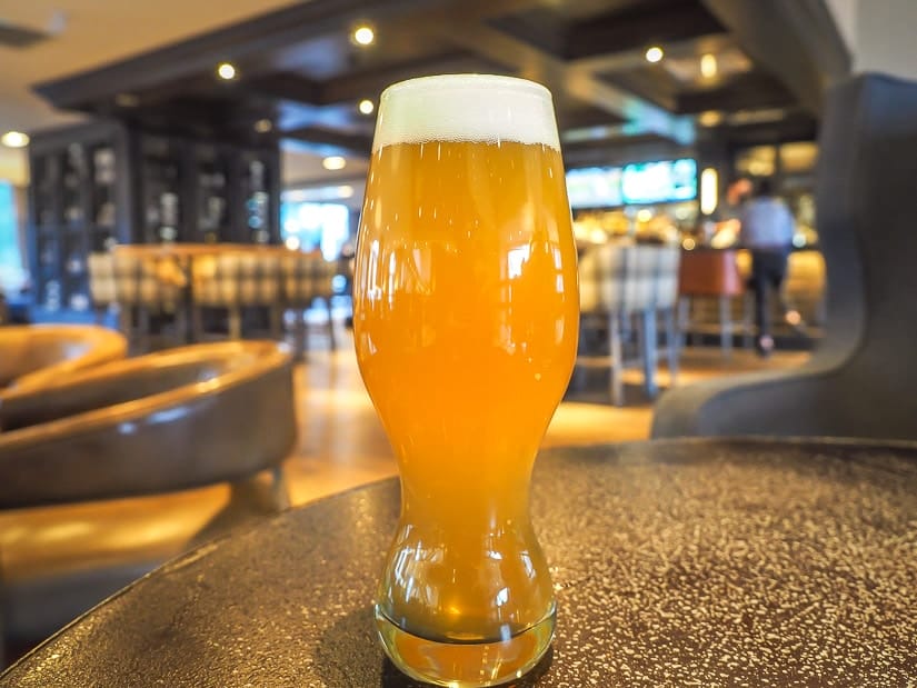 A glass of beer on the table in Blacktail Bar, Kananaskis Mountain Lodge