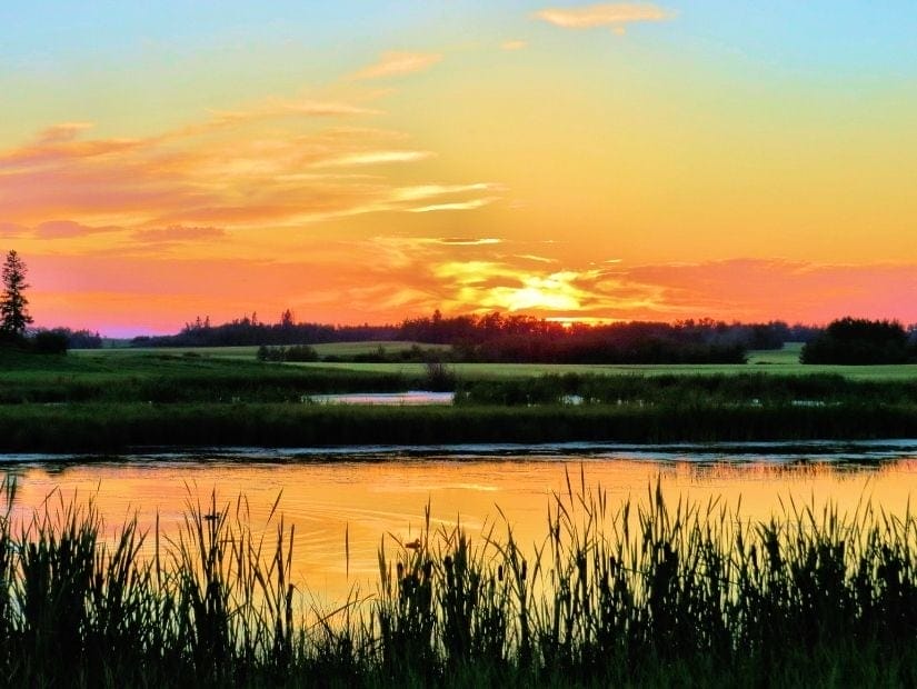Sunset over prairie and lakes in Lacombe, Alberta