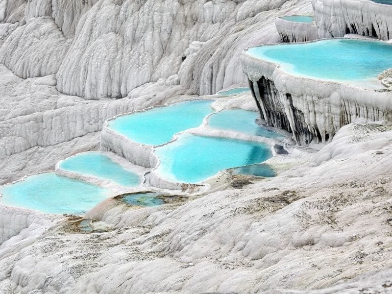 White terraces with blue spring water at Pamukkale, Turkey