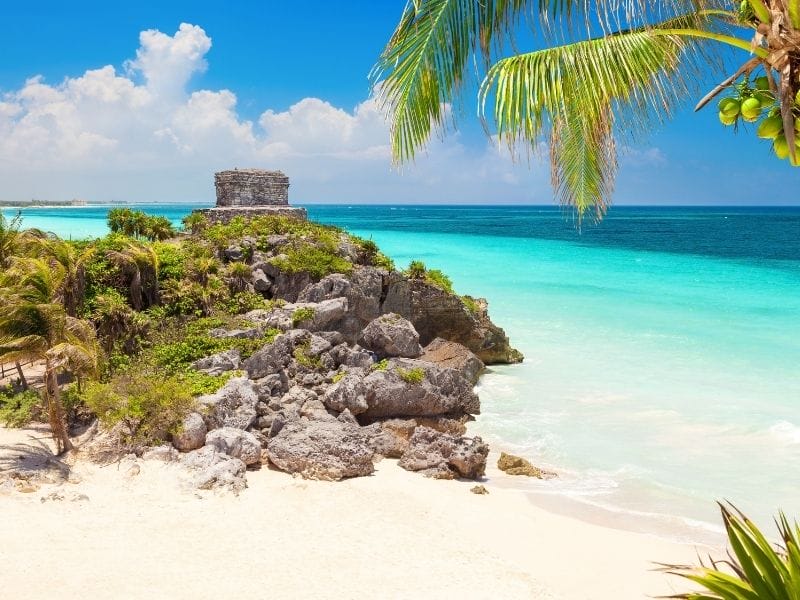Ruins on a white sand beach in Tulum, Mexico