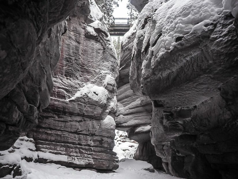 Looking up through narrow section of Maligne Canyon at Fourth Bridge in winter