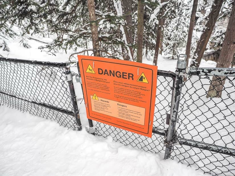 Danger sign on a gate to access Maligne Canyon Icewalk