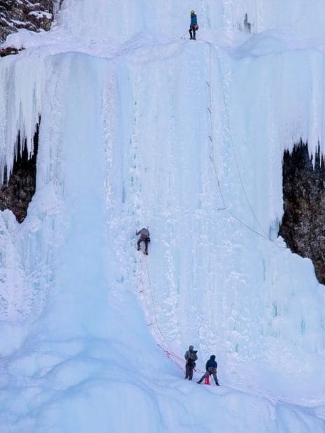 Ice climbers going up a frozen waterfall at Lake Louise in Banff National Park