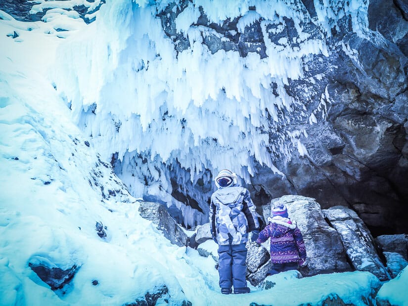 Two kids looking at icicles in Maligne Canyon Jasper