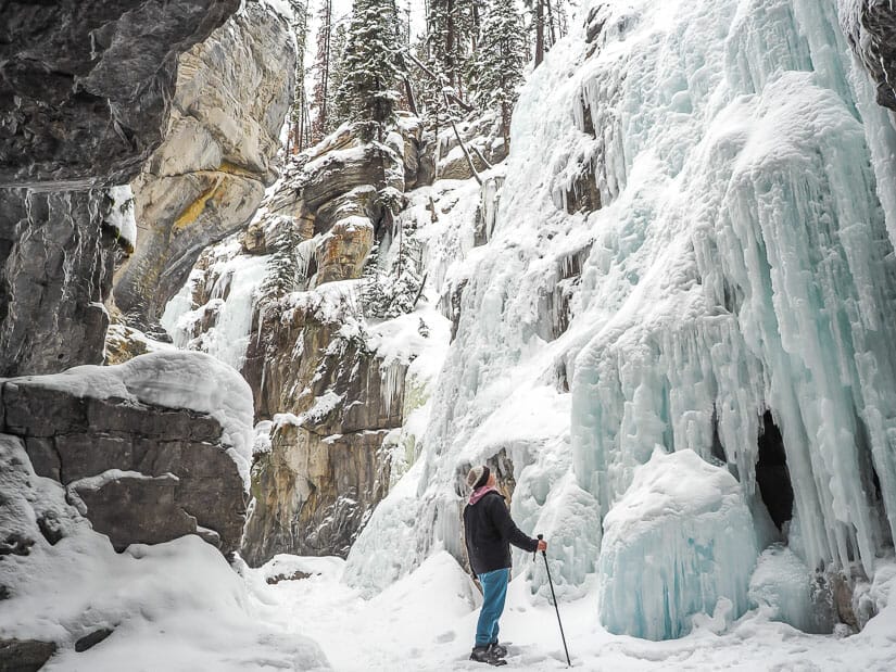Me standing in front of a wall of ice in Maligne Gorge