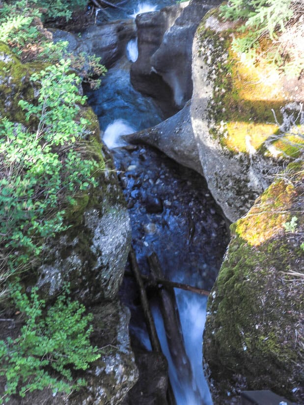 Looking down at a small, multilayered waterfall