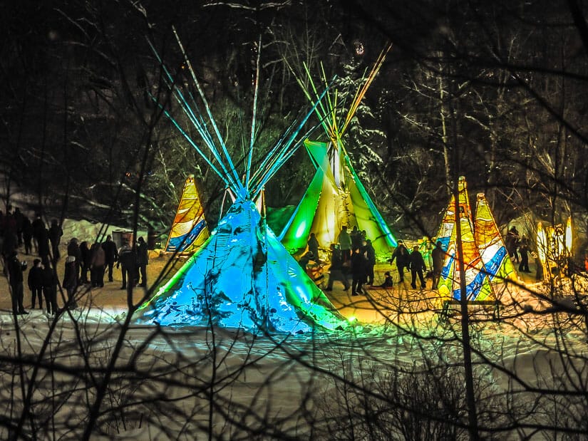 Teepees lit up at night at Flying Canoe Festival Edmonton winter