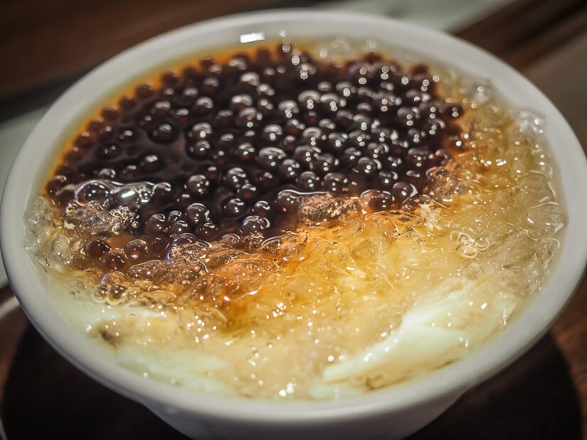 A close up of a bowl of douhua near Yong Kang Street